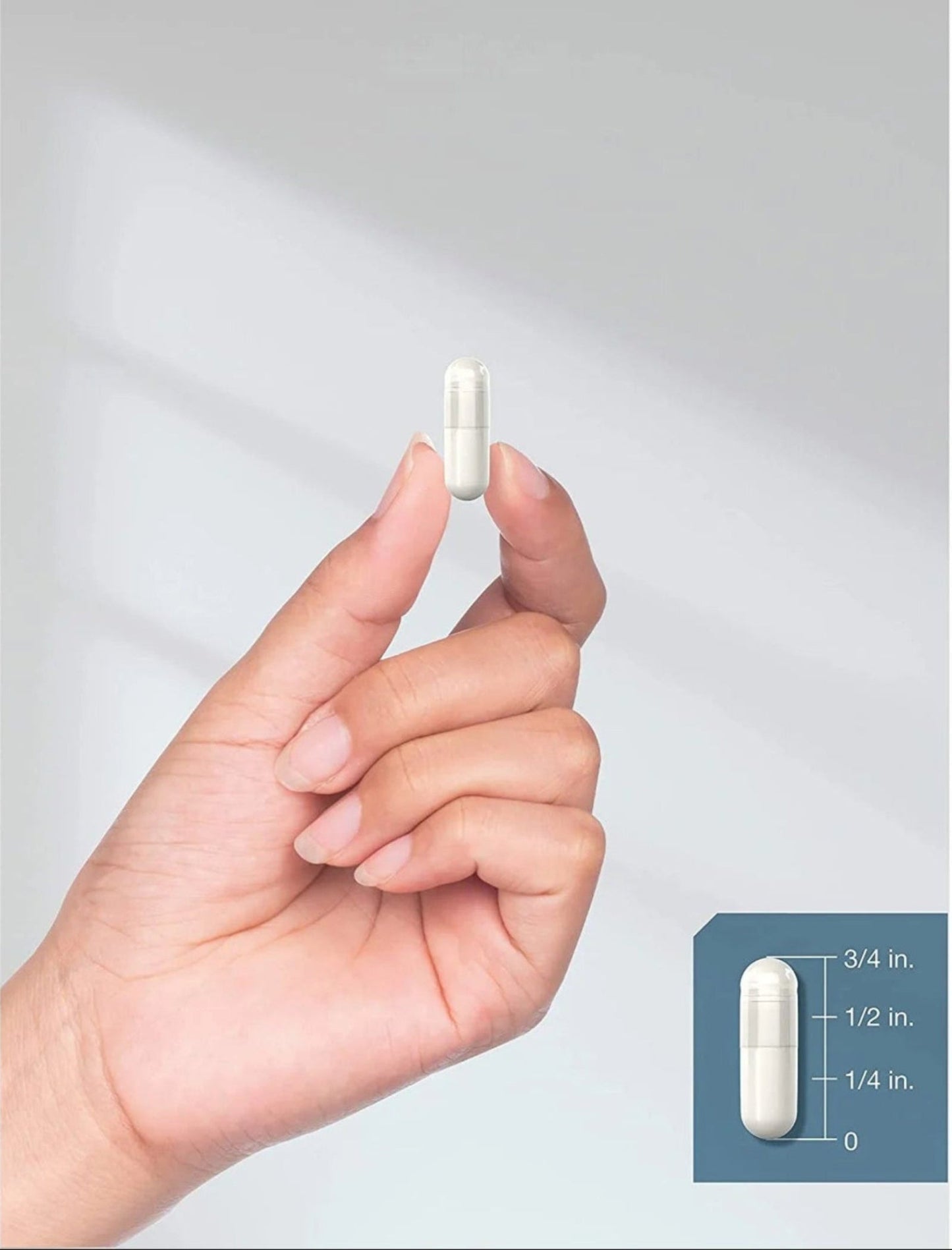VitaCosmoX capsule size with finger and measurement for reference