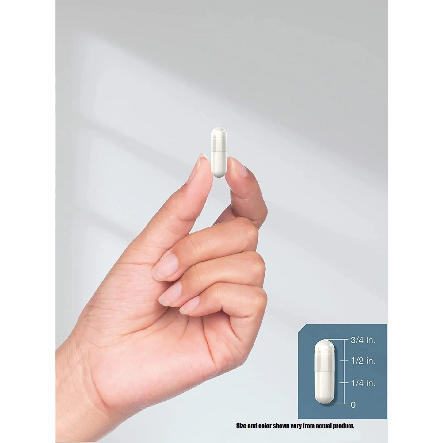 Hand holding a white capsule with size and color information displayed.