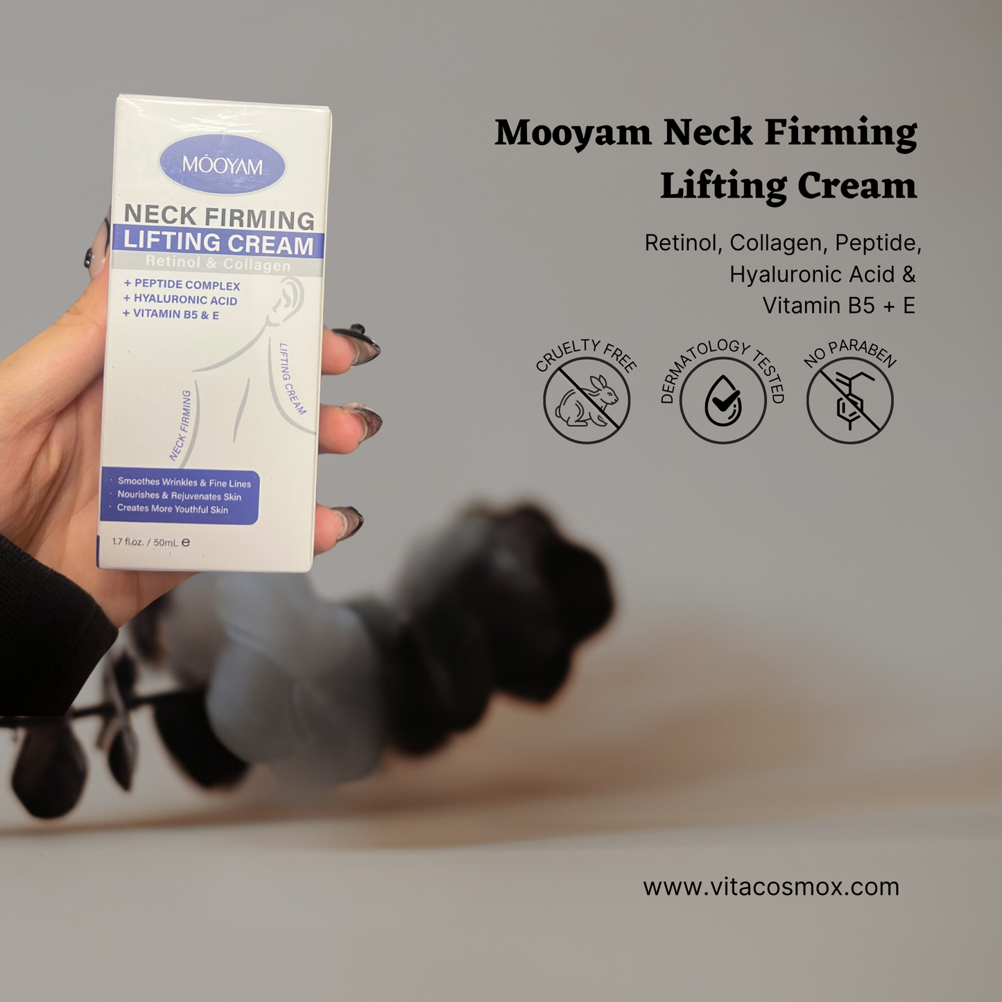 Mooyam Neck Firming Lifting Cream box held by a hand with a blurred background