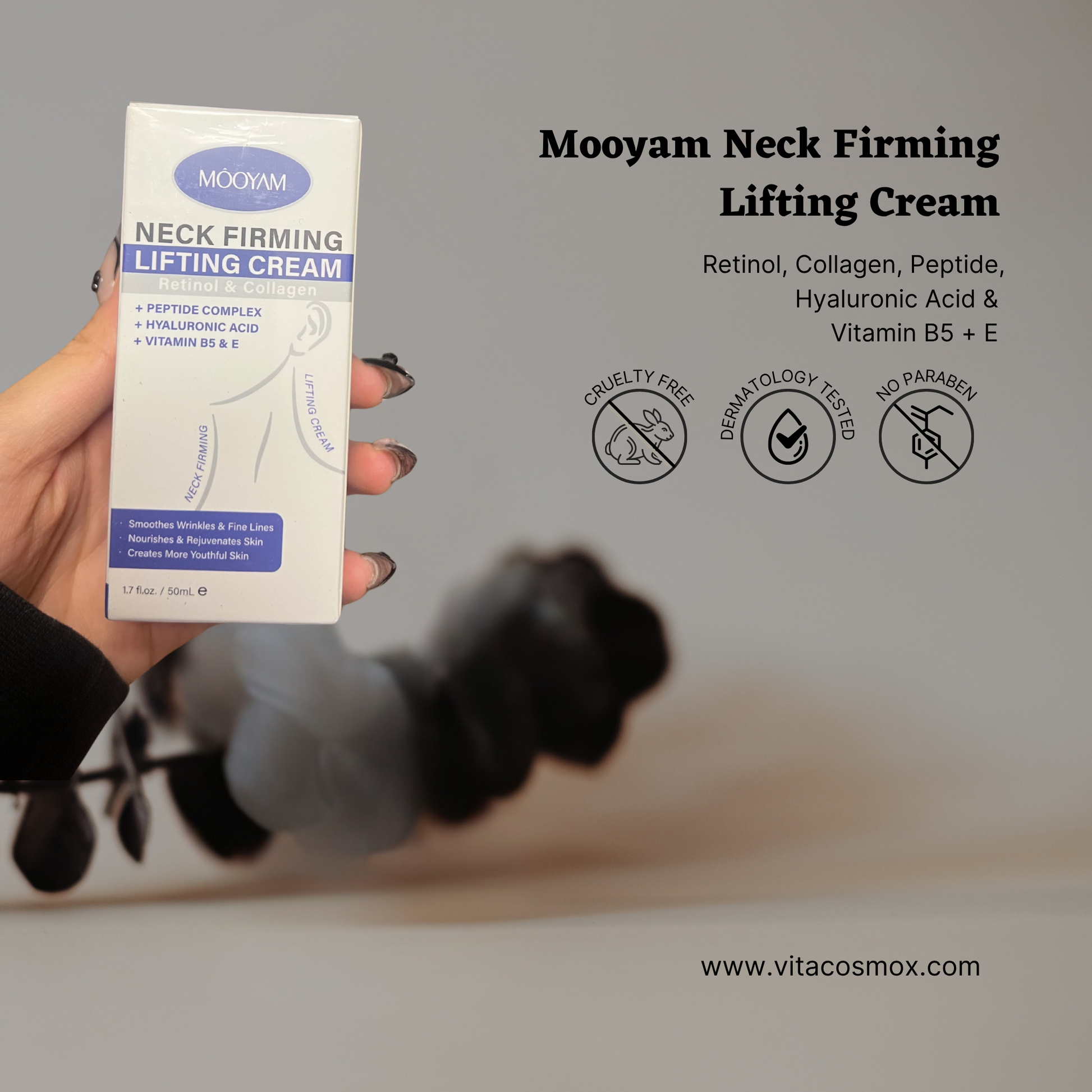 Mooyam Neck Firming Lifting Cream box held by a hand with a blurred background